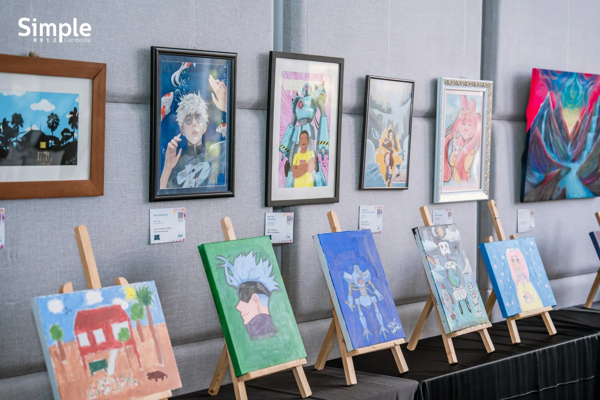 Framed works and canvases on easels